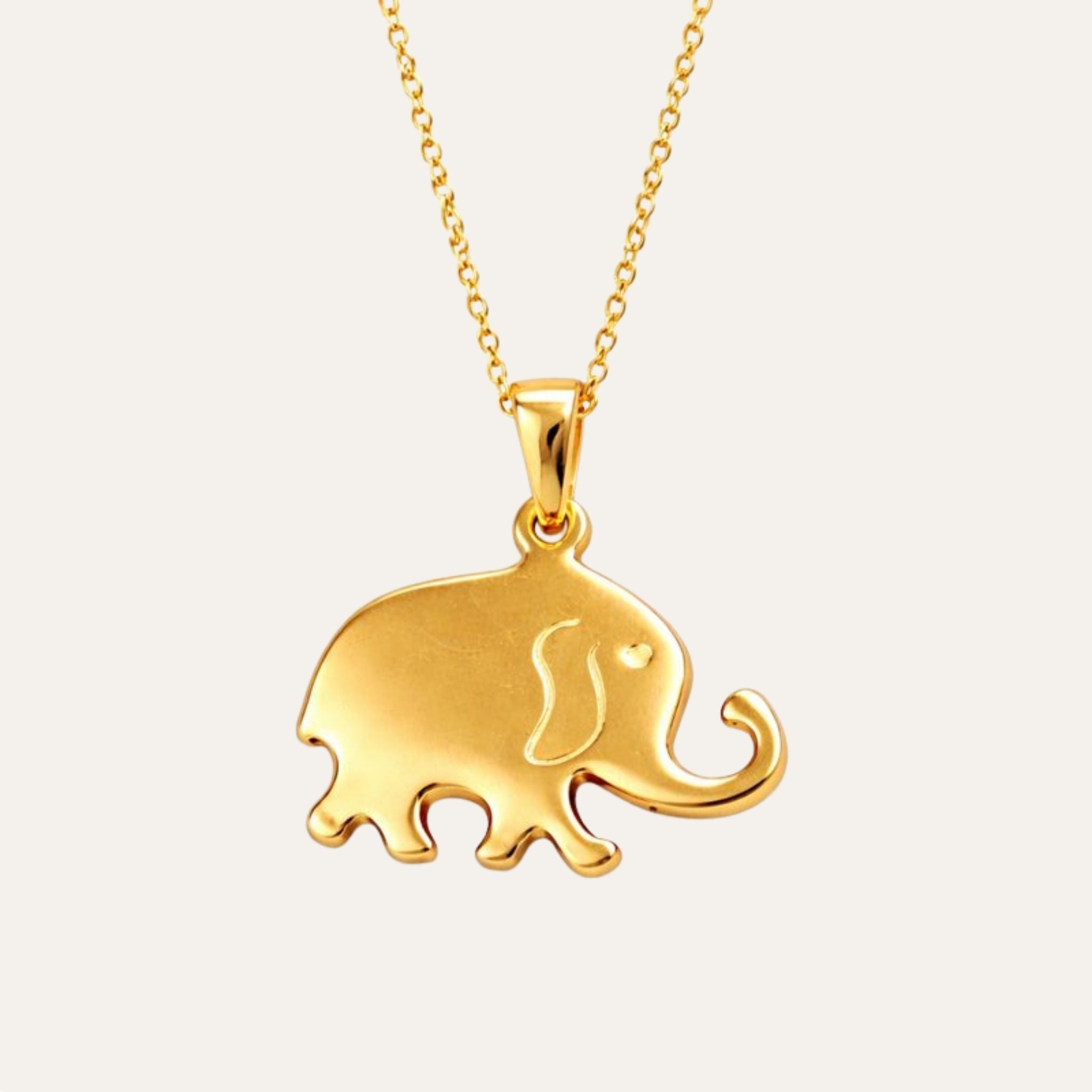 Gold elephant pendant on a chain against a white background